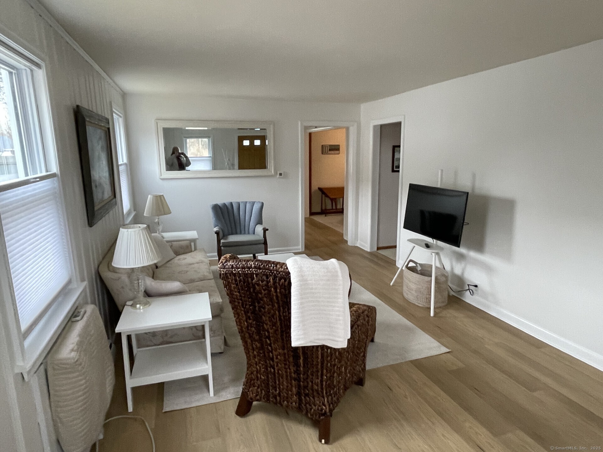 41 Harbor Avenue Madison, CT 06443 - Photo 5 of 27 a living room with furniture wooden floor and a flat screen tv