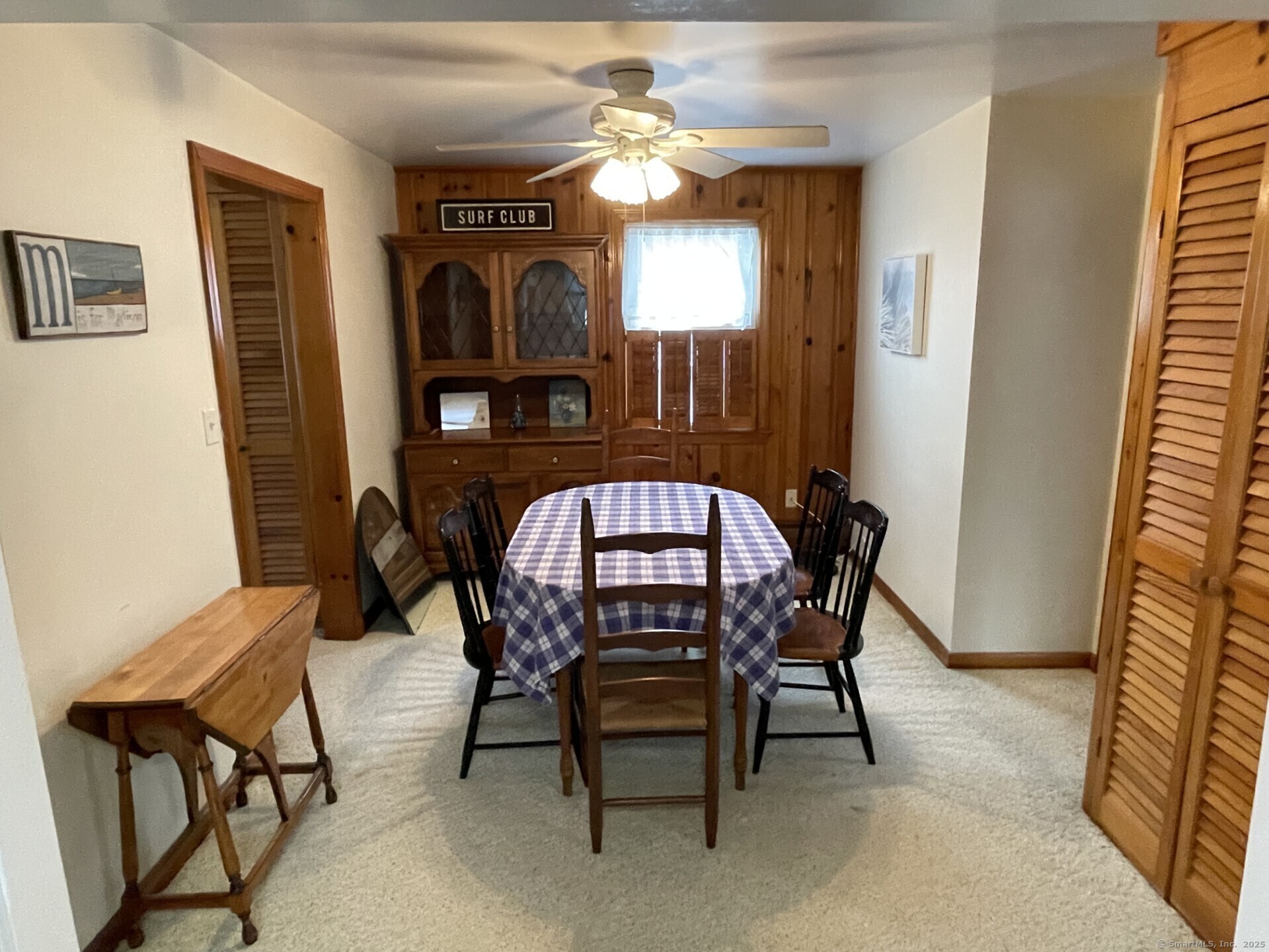 41 Harbor Avenue Madison, CT 06443 - Photo 9 of 27 a view of a dining room with furniture and a chandelier