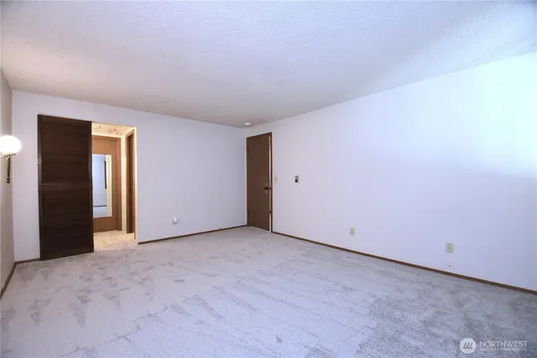 a view of a hallway with seating area