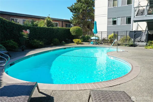 a view of a swimming pool with a patio