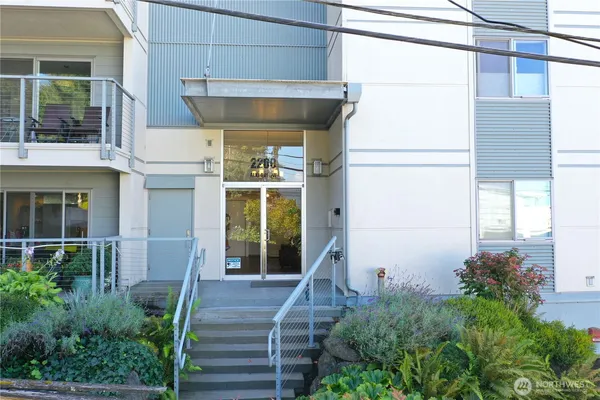 a living room with furniture and a ceiling fan