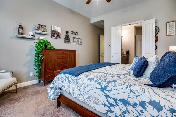 a bedroom with a bed and a couch