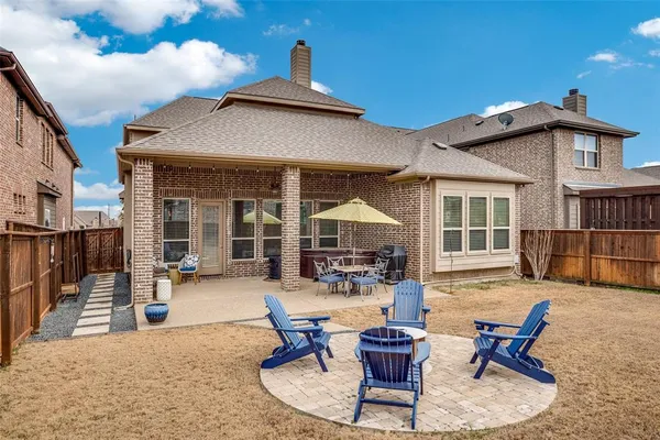 a view of a house with backyard porch and sitting area