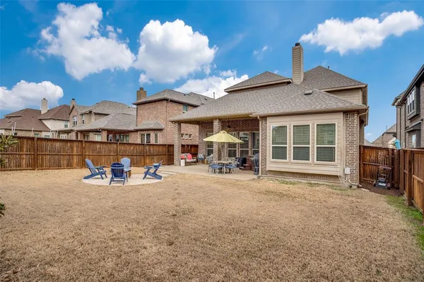 a view of a chairs and table in a patio
