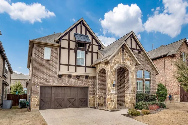 a view of a white house with large windows