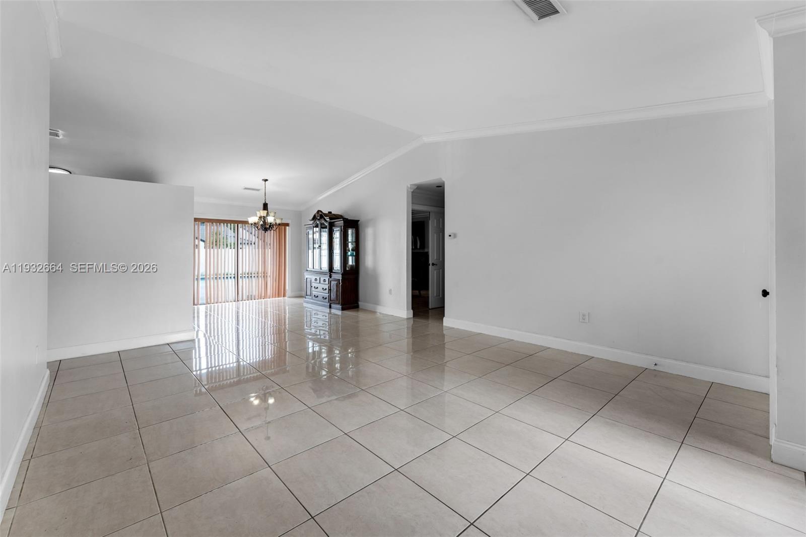 10290 Southwest 145th Place Miami, FL 33186 - Photo 12 of 50 a view of an empty room and window