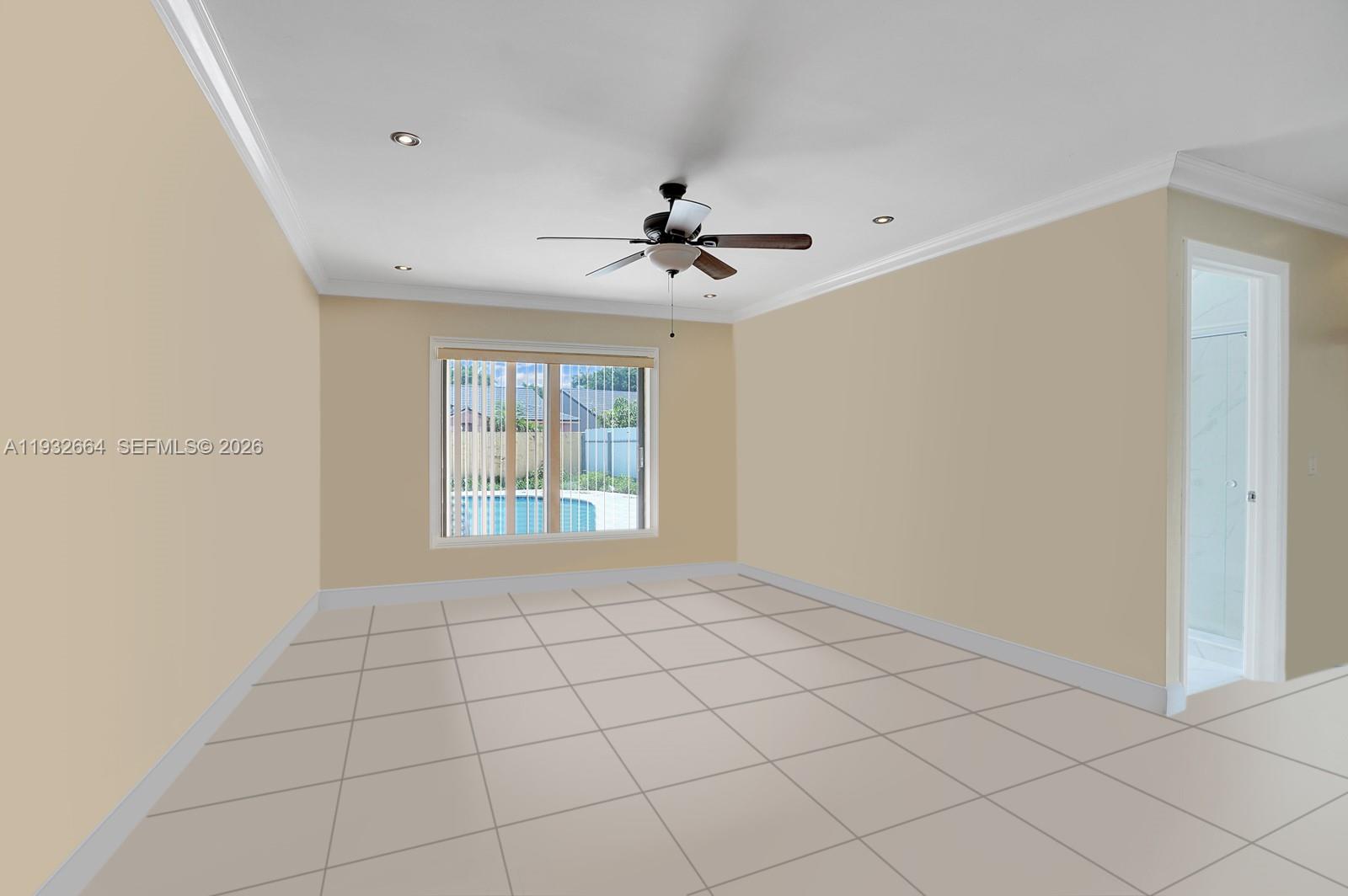 10290 Southwest 145th Place Miami, FL 33186 - Photo 17 of 50 a view of an empty room with a window
