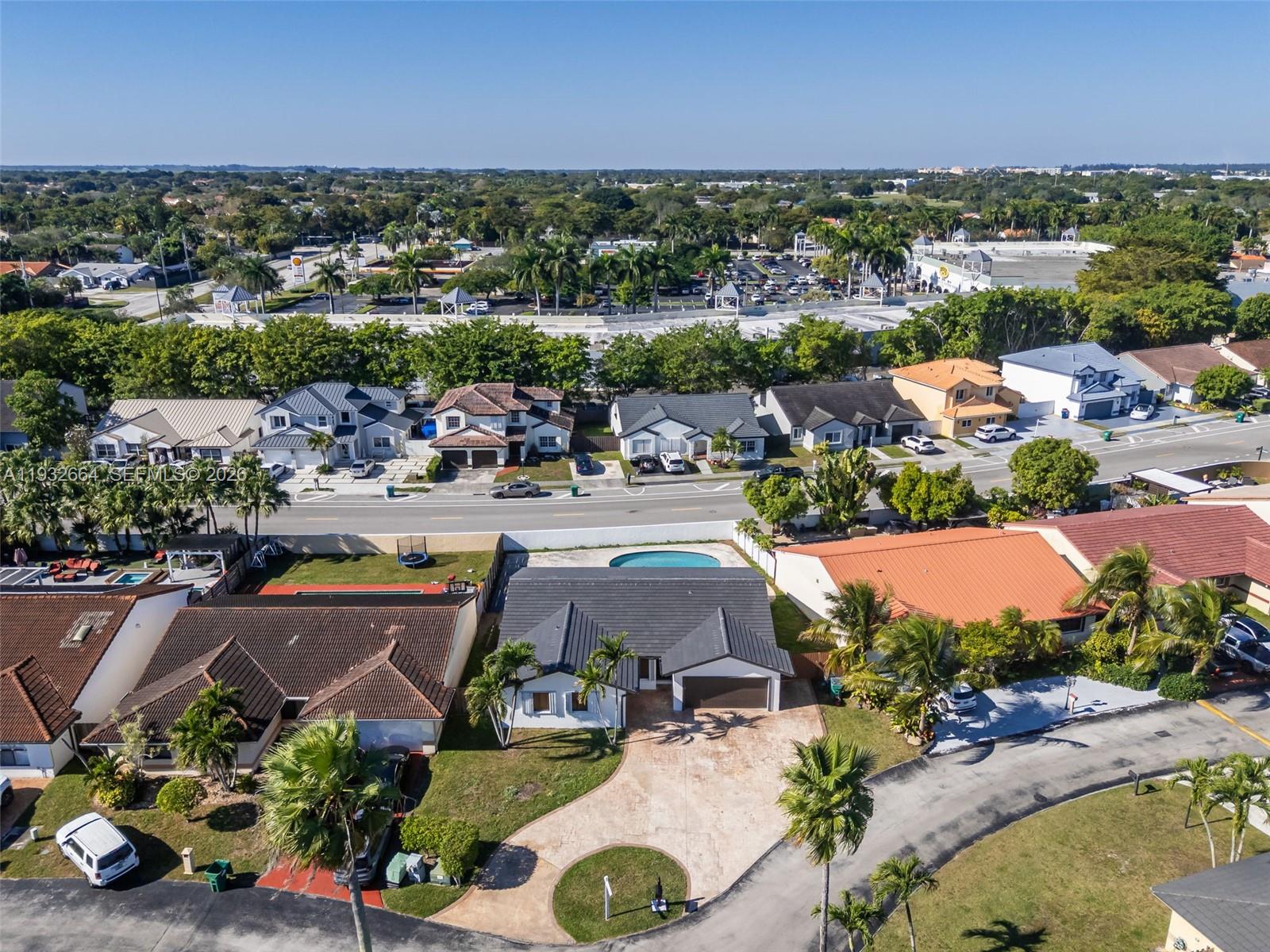 10290 Southwest 145th Place Miami, FL 33186 - Photo 38 of 50 an aerial view of a swimming pool and mountain view in back