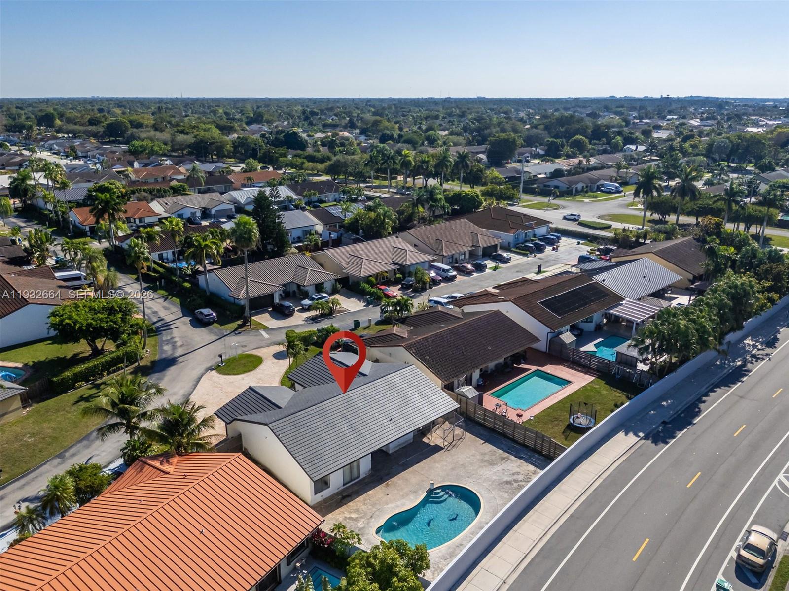 10290 Southwest 145th Place Miami, FL 33186 - Photo 41 of 50 an aerial view of a city with lots of residential buildings