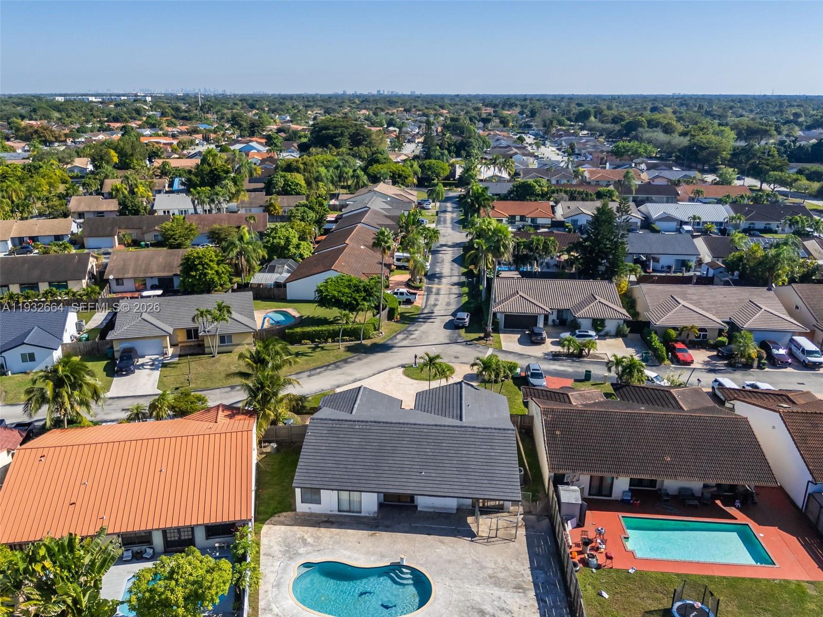 10290 Southwest 145th Place Miami, FL 33186 - Photo 44 of 50 an aerial view of a houses with a city