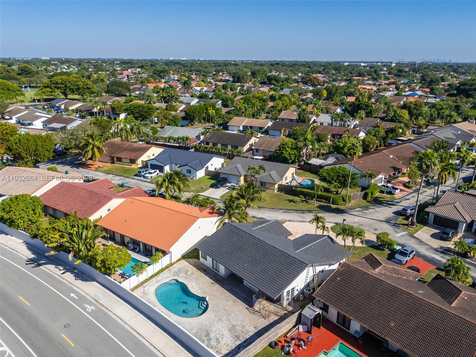 10290 Southwest 145th Place Miami, FL 33186 - Photo 46 of 50 an aerial view of residential houses with outdoor space