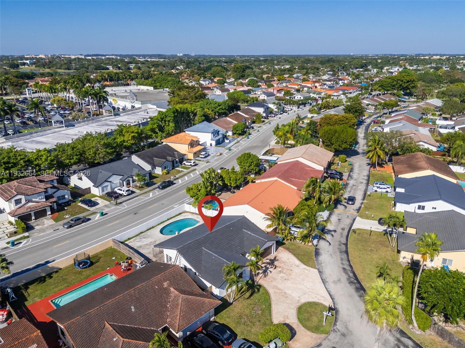 10290 Southwest 145th Place Miami, FL 33186 - Photo 47 of 50 an aerial view of residential houses with outdoor space
