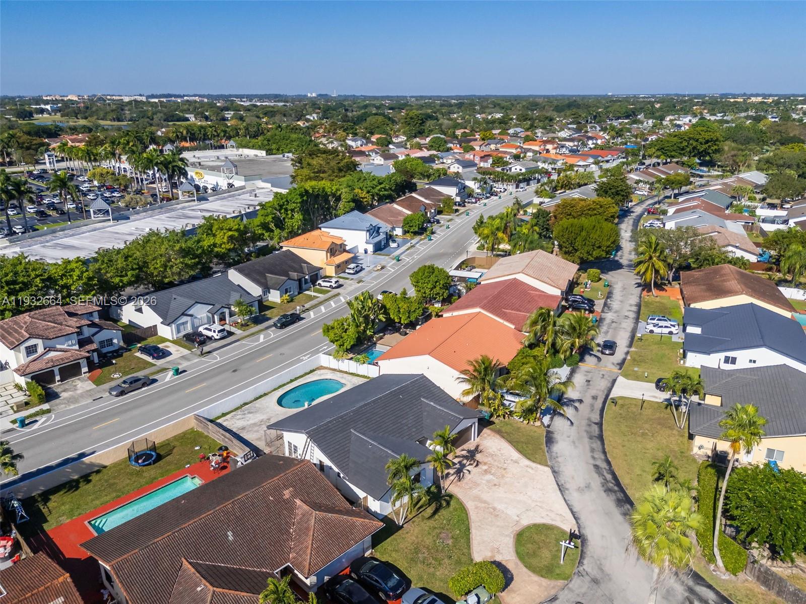 10290 Southwest 145th Place Miami, FL 33186 - Photo 48 of 50 an aerial view of residential houses with outdoor space