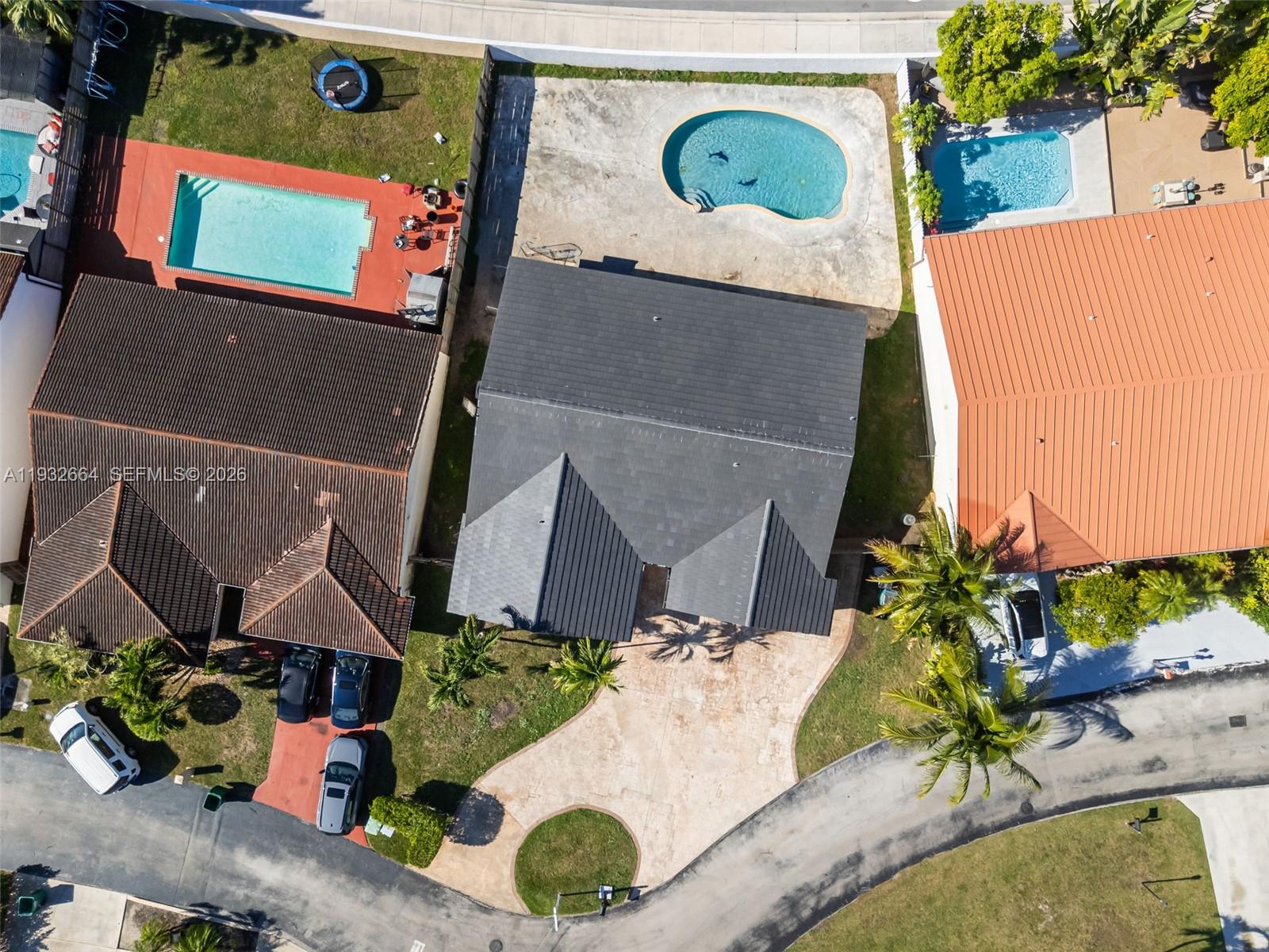 10290 Southwest 145th Place Miami, FL 33186 - Photo 7 of 50 an aerial view of a house with a swimming pool