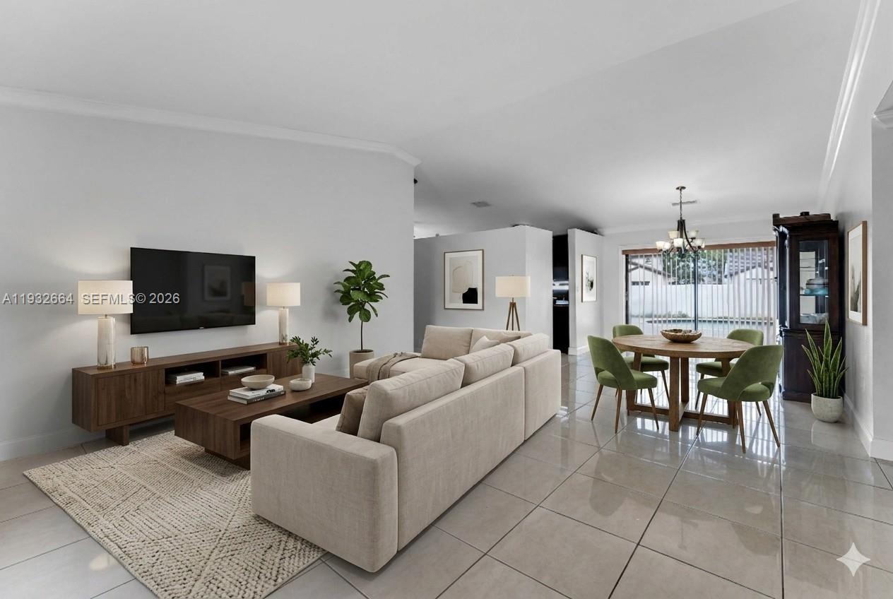 10290 Southwest 145th Place Miami, FL 33186 - Photo 9 of 50 a living room with furniture and a flat screen tv