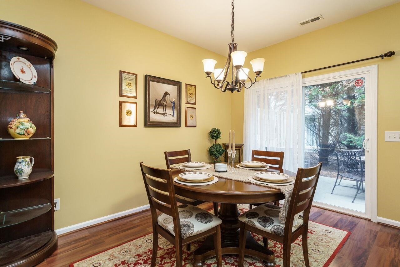 8513 Silhouette Place Raleigh, NC 27613 - Photo 11 of 36 Dining with a view to the peaceful back patio. Dining Room