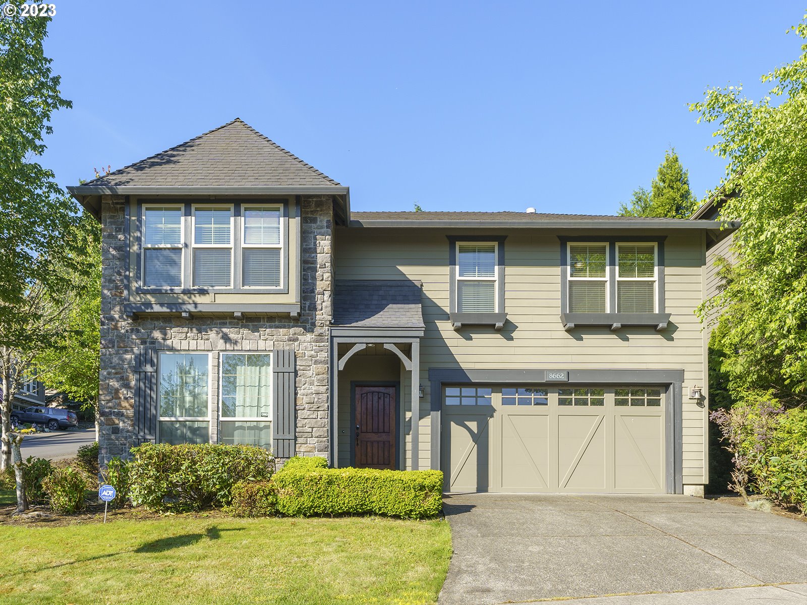8662 Southwest 184th Drive Beaverton, OR 97007 - Photo 1 of 1 a front view of a house with a garden