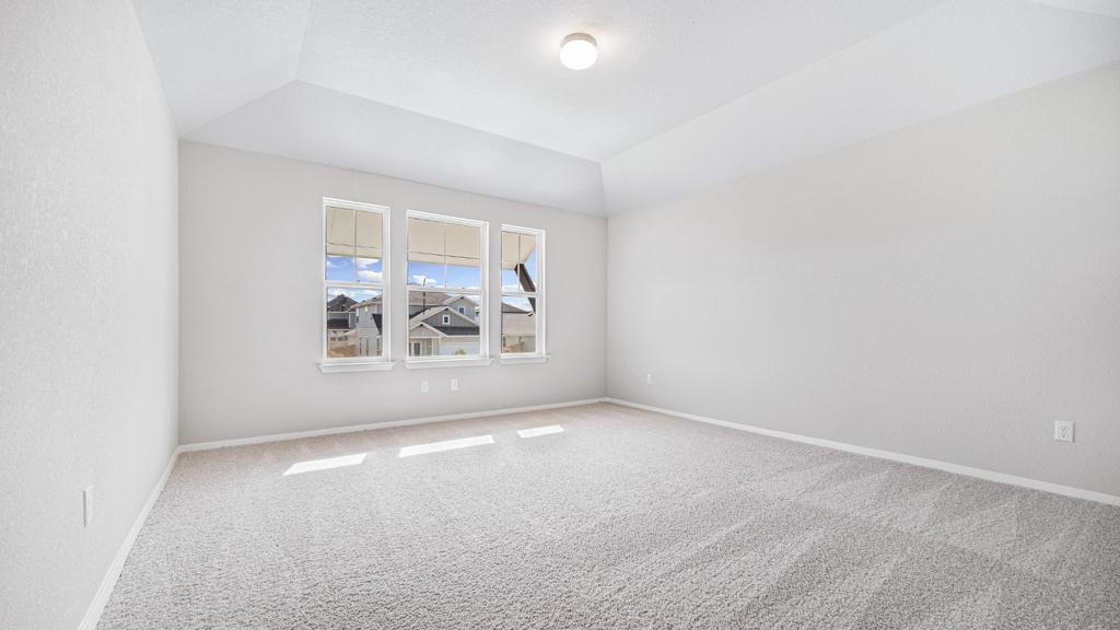 208 Stein Road Georgetown, TX 78626 - Photo 24 of 30 Carpeted spare room with lofted ceiling and baseboards