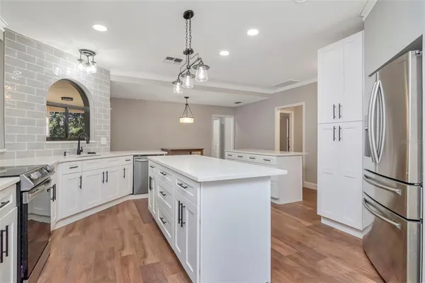 a kitchen with a sink and cabinets