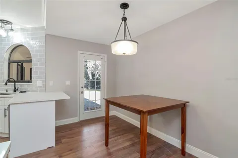 a view of a room with wooden floor