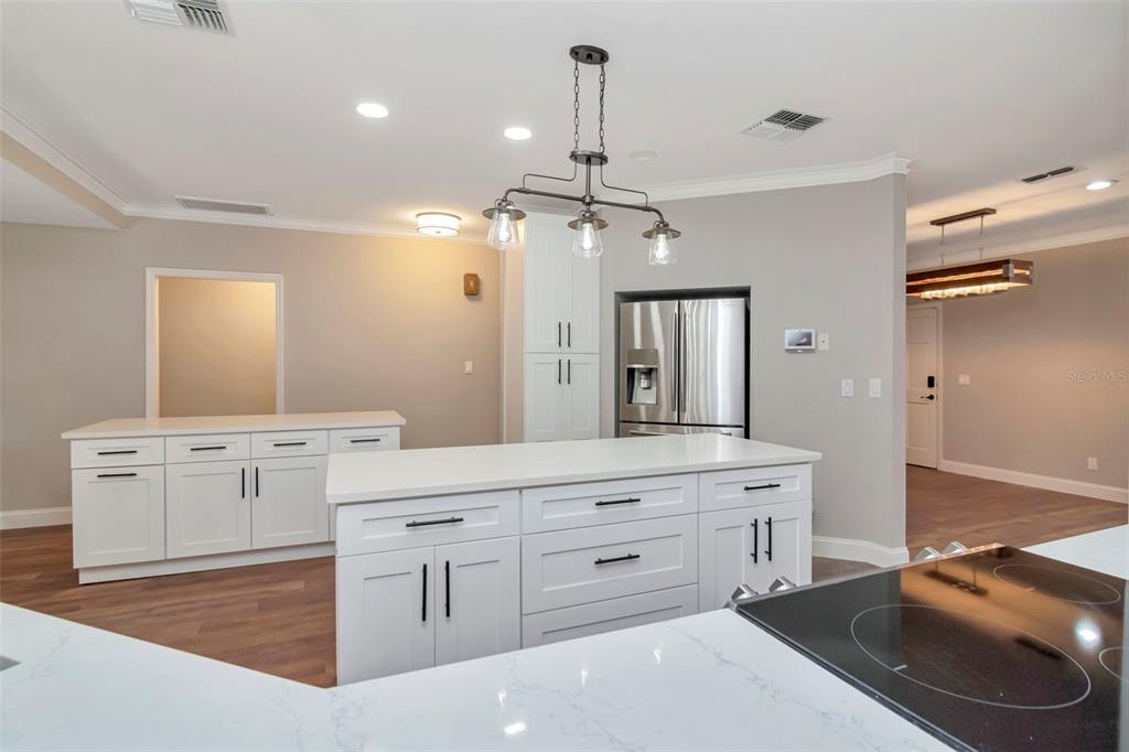 18306 Pleasant Ridge Place Lutz, FL 33548 - Photo 32 of 64 a spacious bathroom with a granite countertop sink a toilet a mirror and vanity
