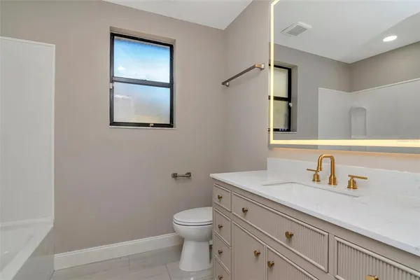 a view of a backyard with large trees