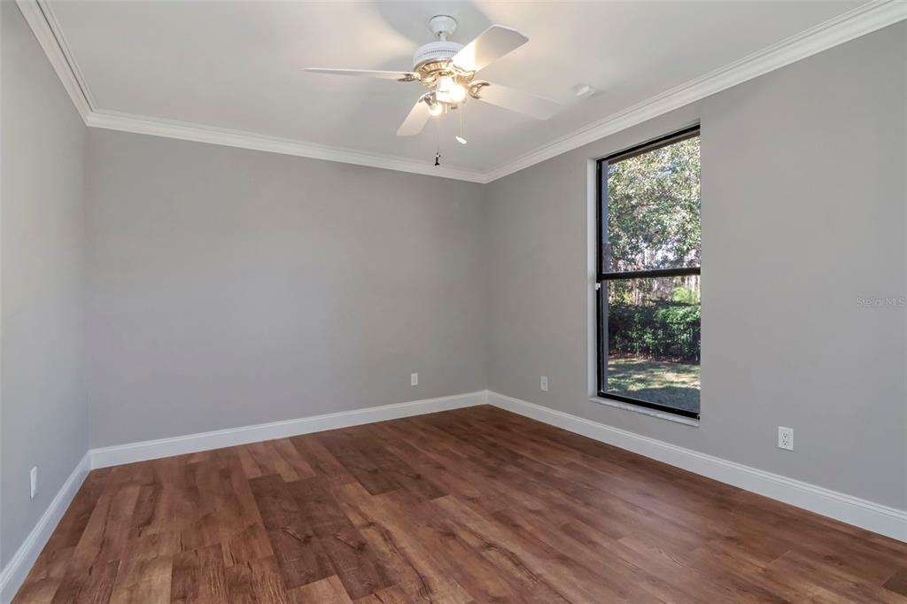 18306 Pleasant Ridge Place Lutz, FL 33548 - Photo 46 of 64 wooden floor in an empty room with a window