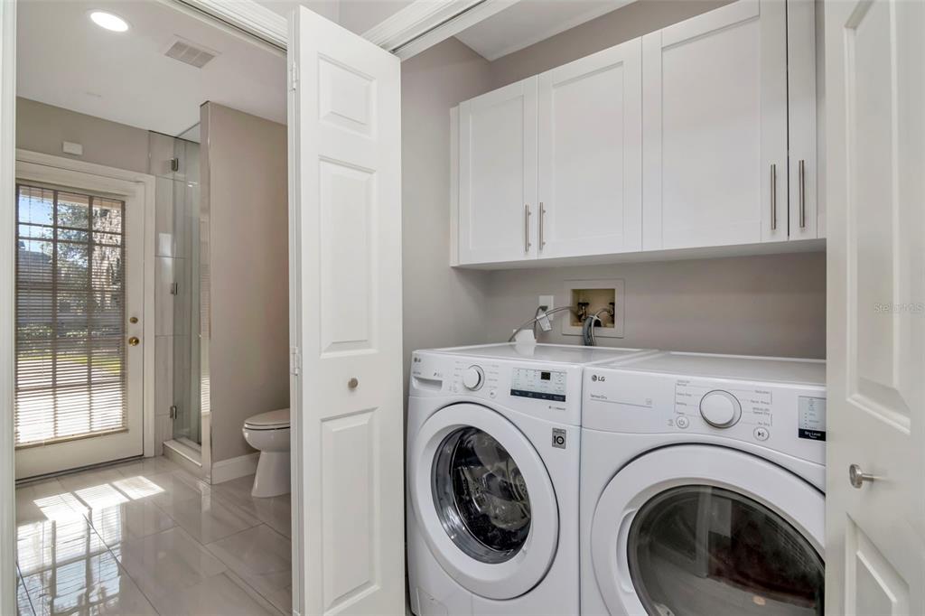 18306 Pleasant Ridge Place Lutz, FL 33548 - Photo 47 of 64 a view of hallway with washer and dryer