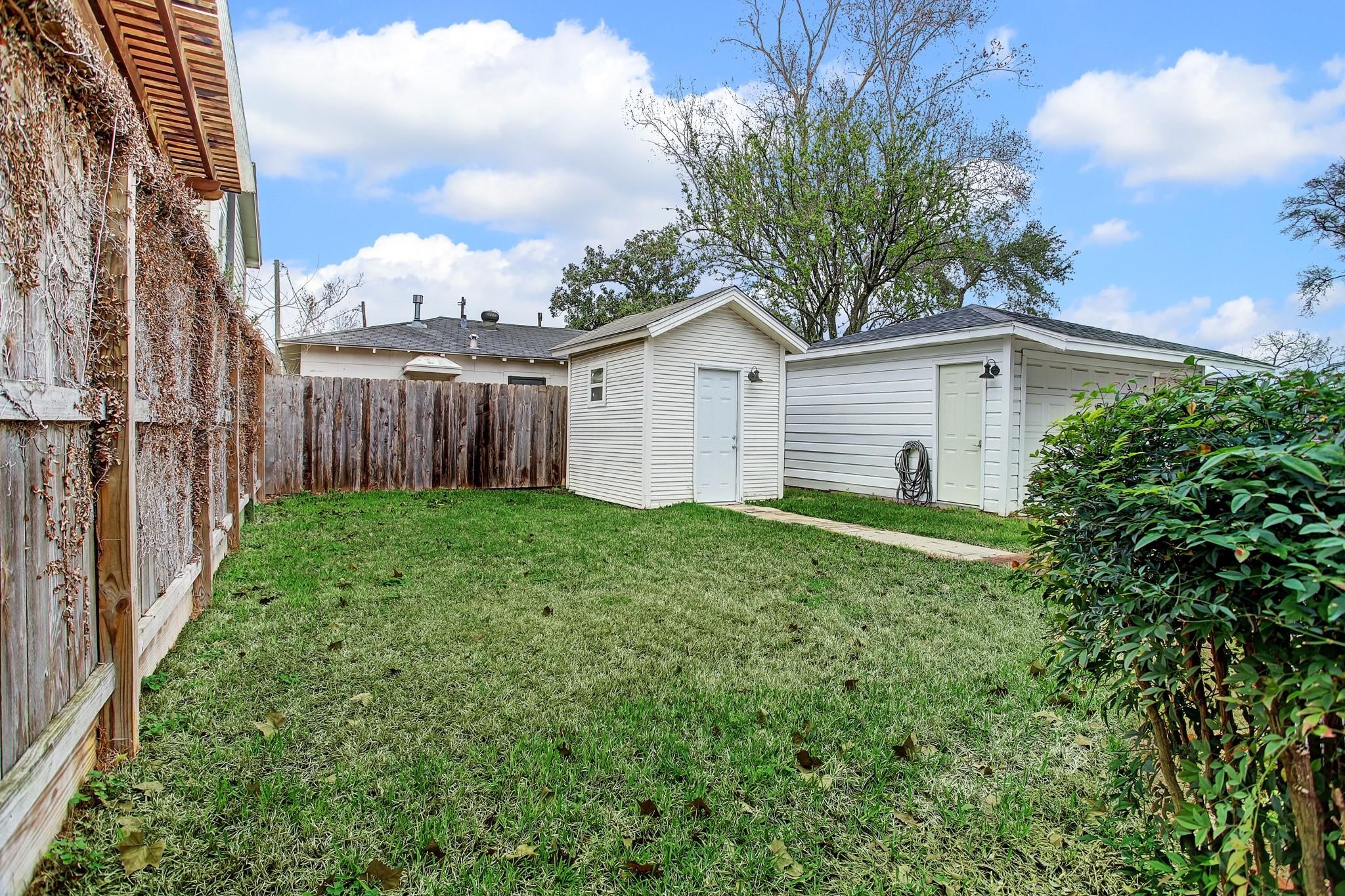 127 Payne Street Houston, TX 77009 - Photo 18 of 23 View from the end of the walkway that leads to the backyard.