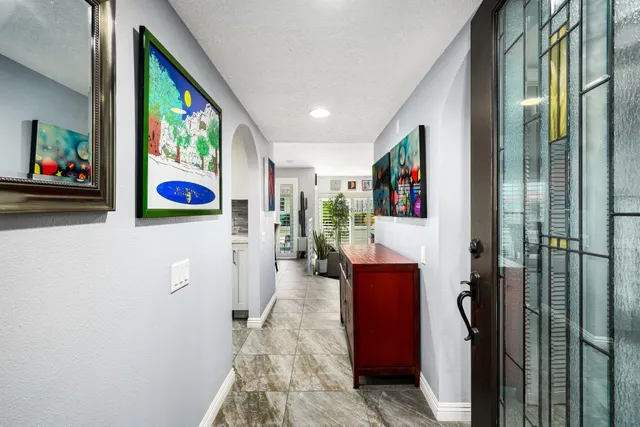 a living room with furniture rug and window