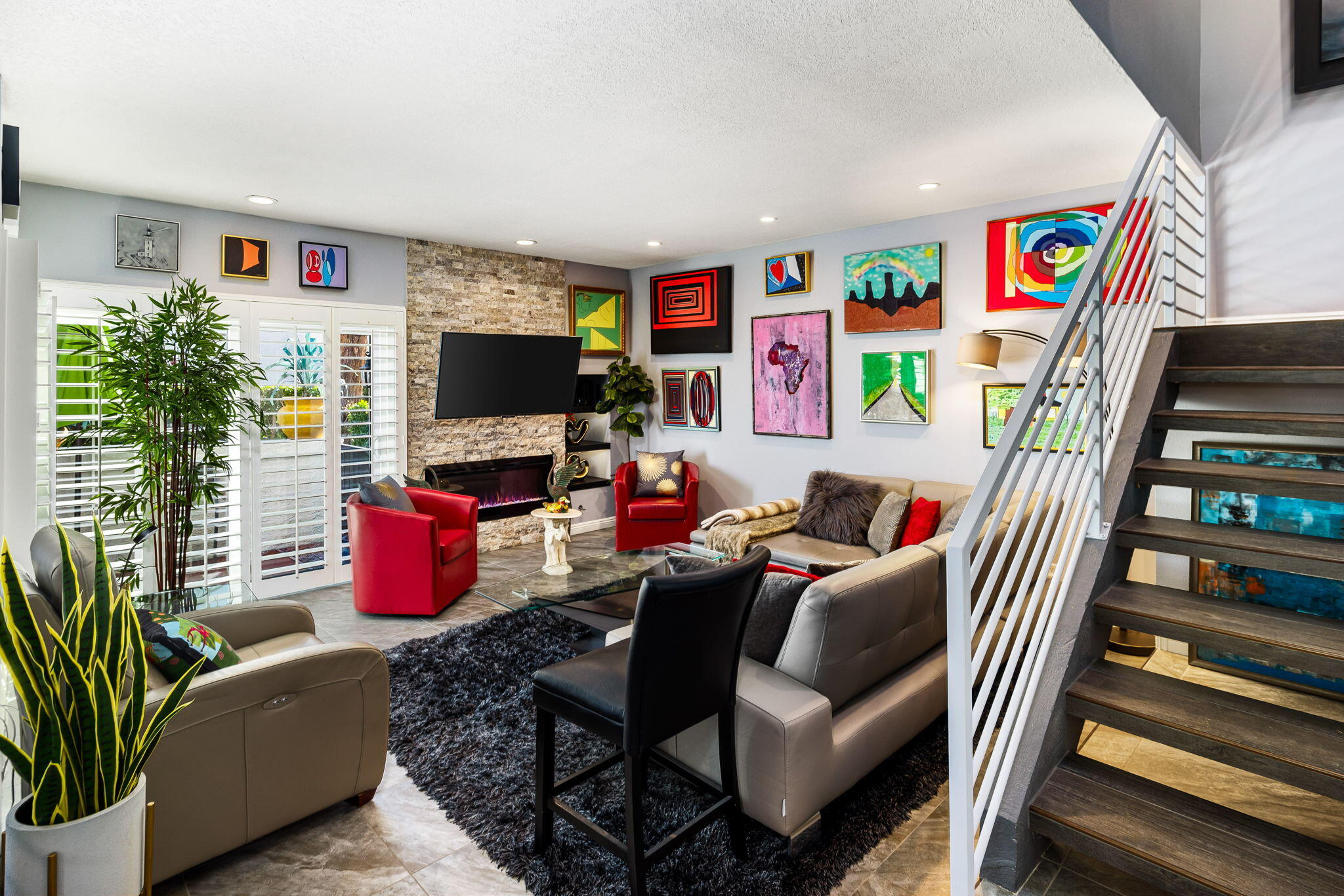 412 Rio Vista Drive Palm Springs, CA 92262 - Photo 12 of 45 a living room with furniture a flat screen tv and a potted plant