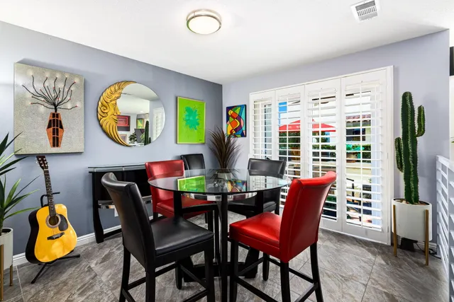 a kitchen with a refrigerator and a stove