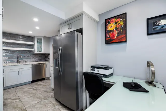 a kitchen with a stove and a sink