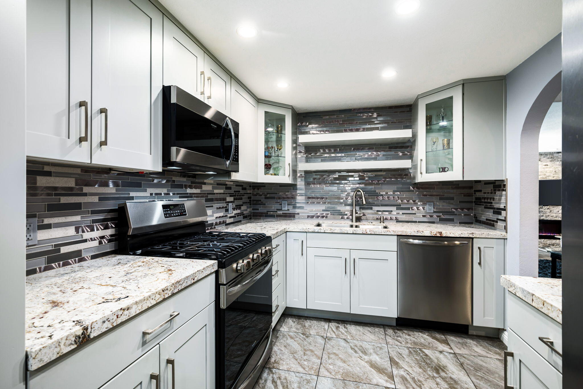 412 Rio Vista Drive Palm Springs, CA 92262 - Photo 19 of 45 a kitchen with stainless steel appliances kitchen island granite countertop a sink stove and cabinets