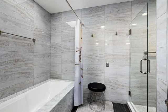 a bathroom with a sink toilet and shower