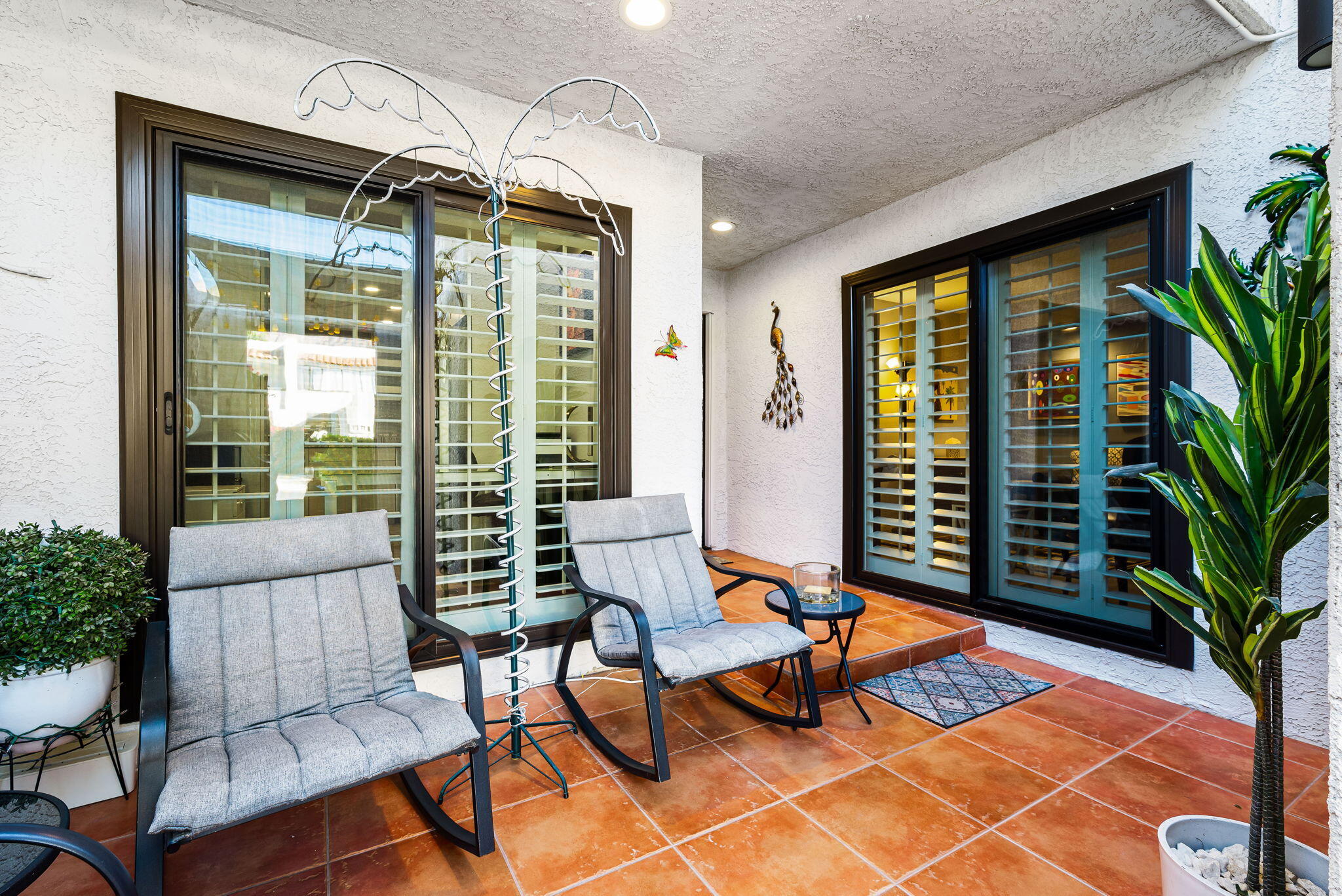 412 Rio Vista Drive Palm Springs, CA 92262 - Photo 8 of 45 a balcony with furniture and potted plants