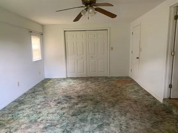 a view of an empty room and window