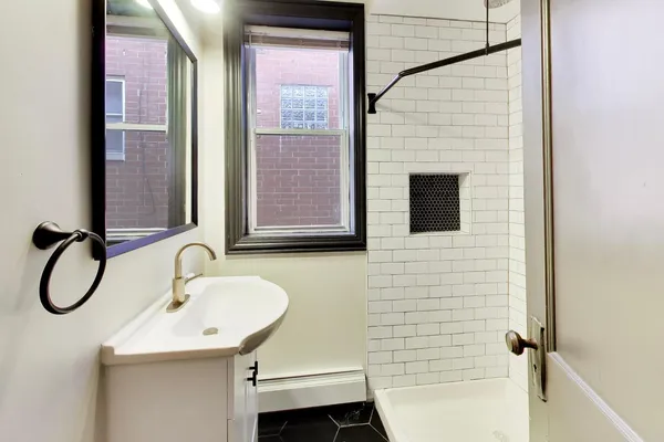 a bathroom with a sink and a mirror
