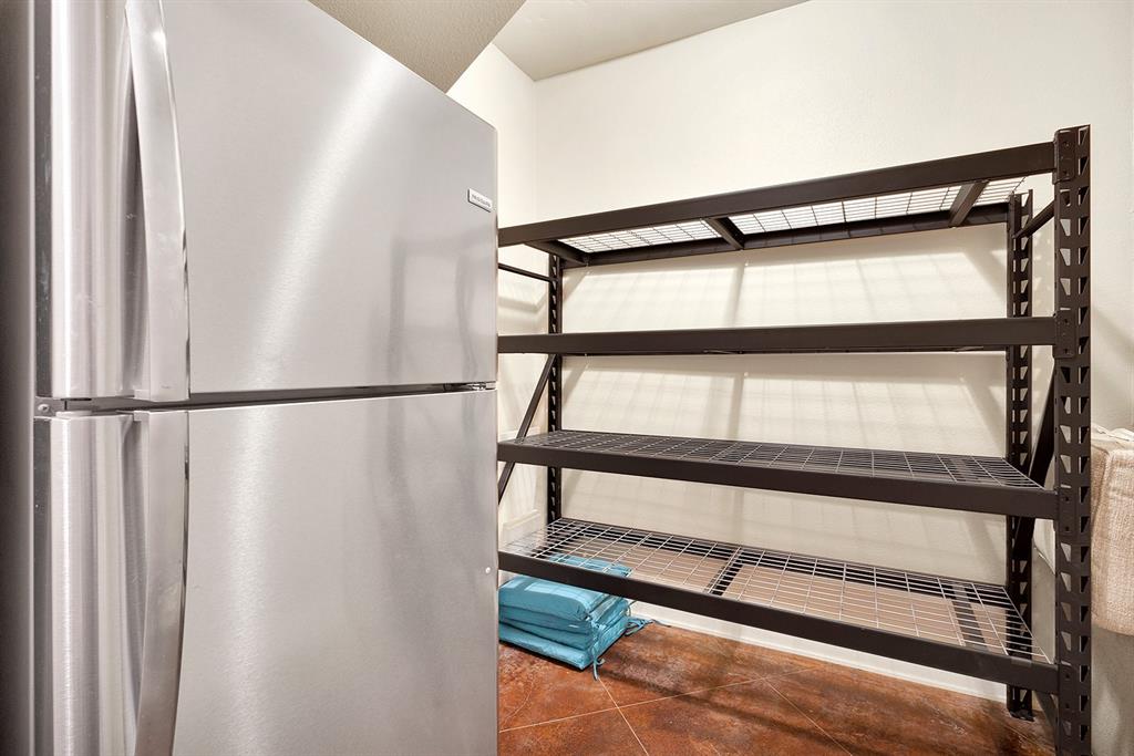 103 Glenn Road Mabank, TX 75156 - Photo 30 of 40 Large Storage Closet Downstairs w/Refrigerator