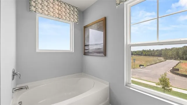 a bathroom with a sink a mirror and a shower