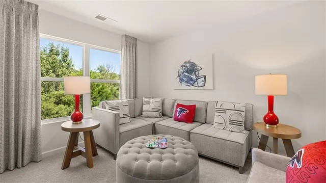 a aerial view of a house with a yard and potted plants