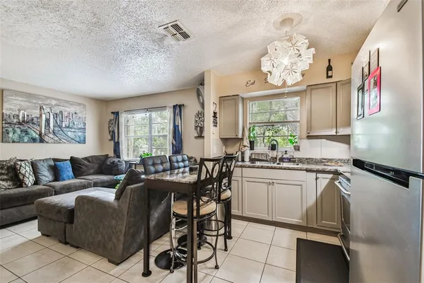 a living room with granite countertop furniture and a large window