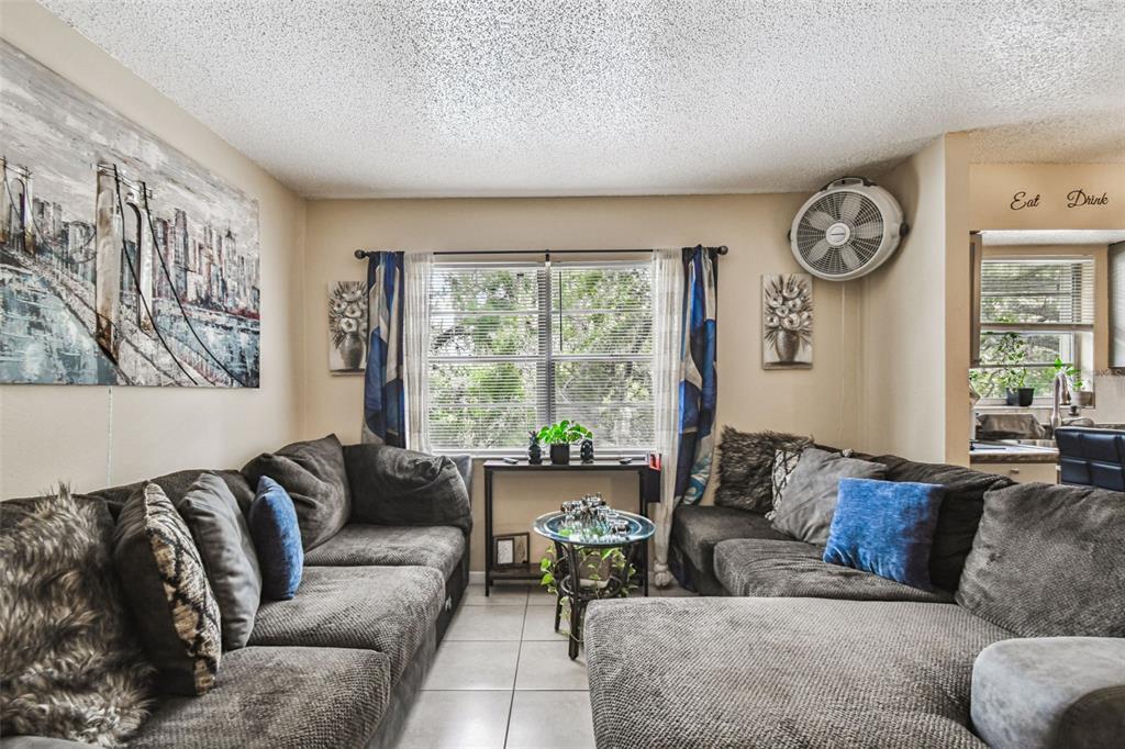 7902 North 14th Street Tampa, FL 33604 - Photo 12 of 25 a living room with furniture and a large window