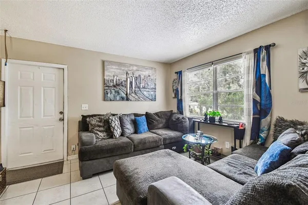 a living room with furniture and a large window