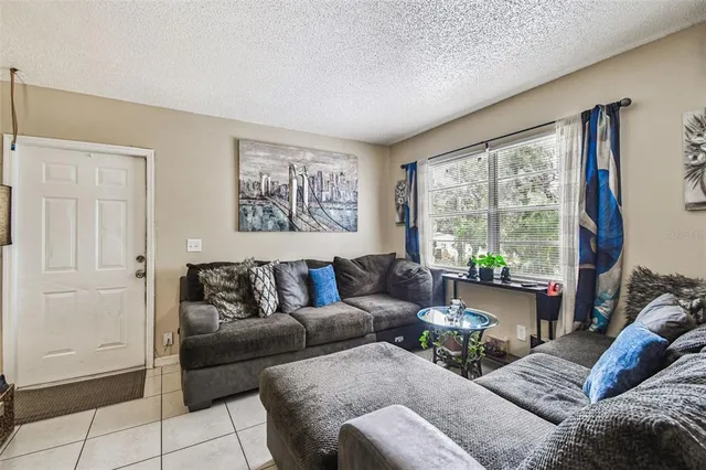 a living room with furniture and a large window