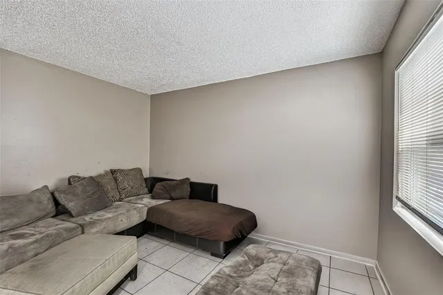 a living room with a couch and a window