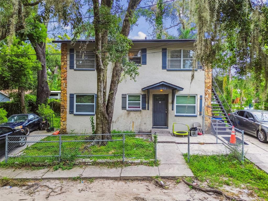 7902 North 14th Street Tampa, FL 33604 - Photo 23 of 25 a front view of house with yard and green space