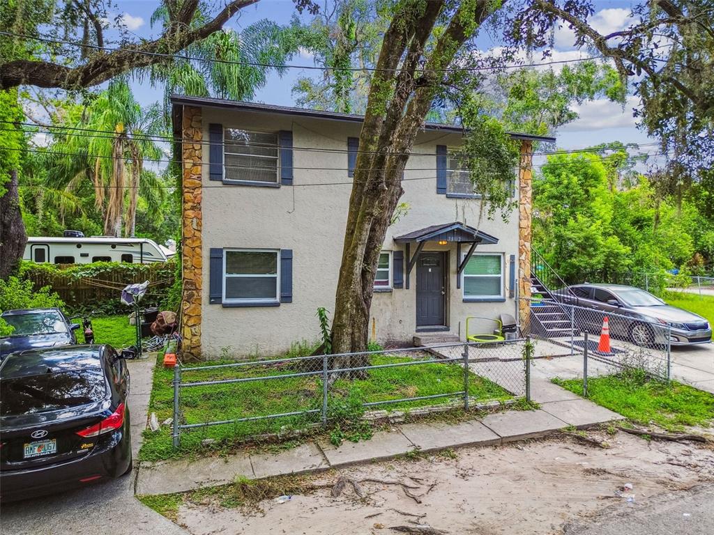 7902 North 14th Street Tampa, FL 33604 - Photo 24 of 25 a front view of a house with a garden and plants