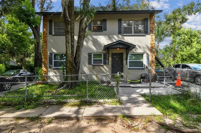 a front view of house with outdoor seating