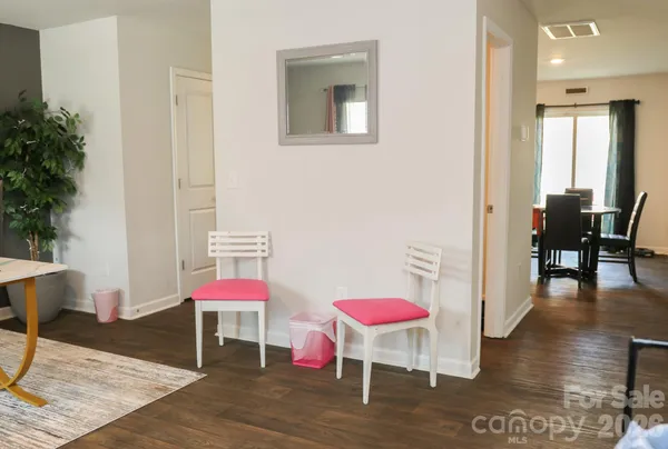 a room with furniture and wooden floor